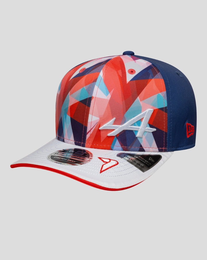 Colorful geometric print cap with blue side panels, a white front brim with red edge and a white A logo.