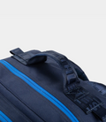 Close-up of navy Built for Athletes 45L backpack showing a blue zipper and strap details
