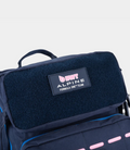 Navy BWT Alpine 45L backpack with a front patch reading BWT Alpine Formula One Team