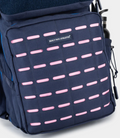 Close up of navy blue Built for Athletes 45L backpack front panel with pink dash accents and a Built for Athletes patch