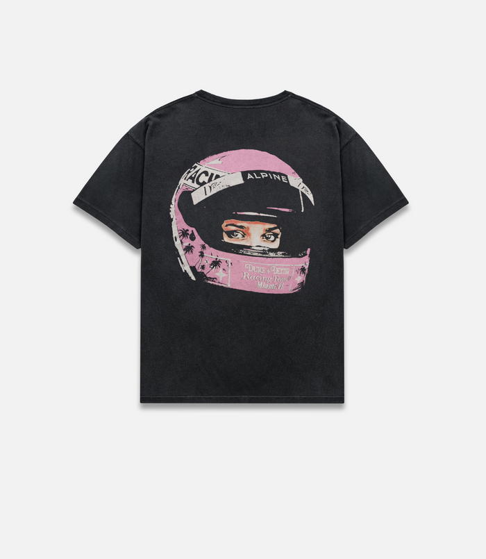 Back view of washed black T-shirt with pink helmet graphic and racing design.