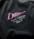 Back view of a washed black Duke and Dexter T shirt featuring a pink helmet logo for BWT Alpine team