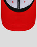 Front view of a bright red New Era 9Seventy cap with a curved brim and black underbill.