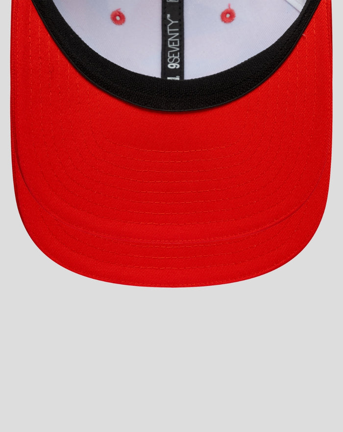 Front view of a bright red New Era 9Seventy cap with a curved brim and black underbill.