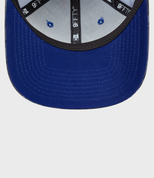 Underside of brim and rear adjustable strap of navy floral 9Fifty cap