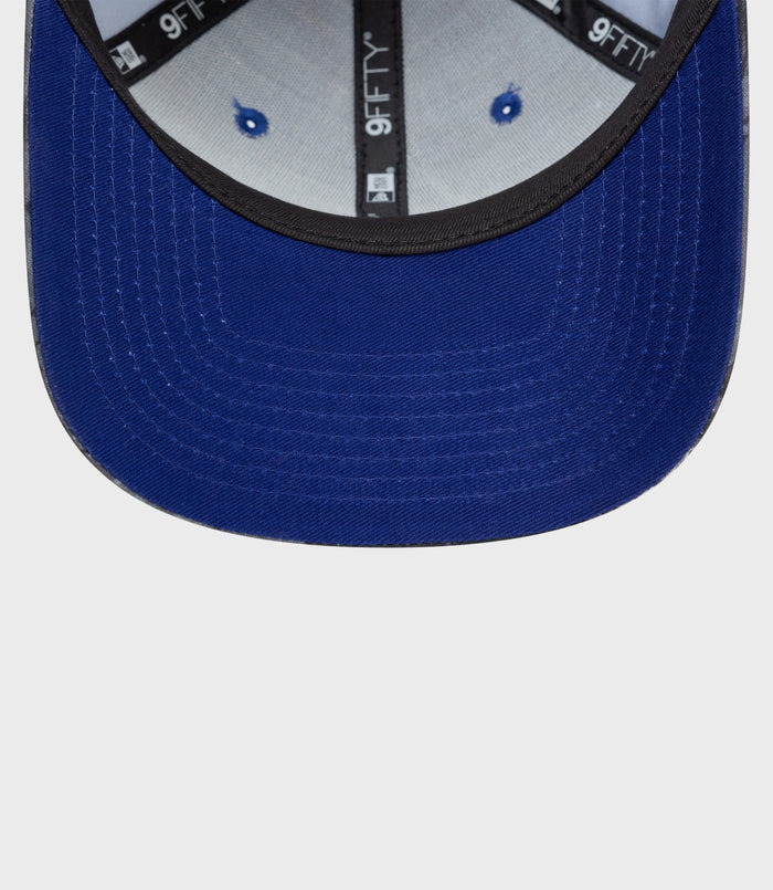 Underside of brim and rear adjustable strap of navy floral 9Fifty cap
