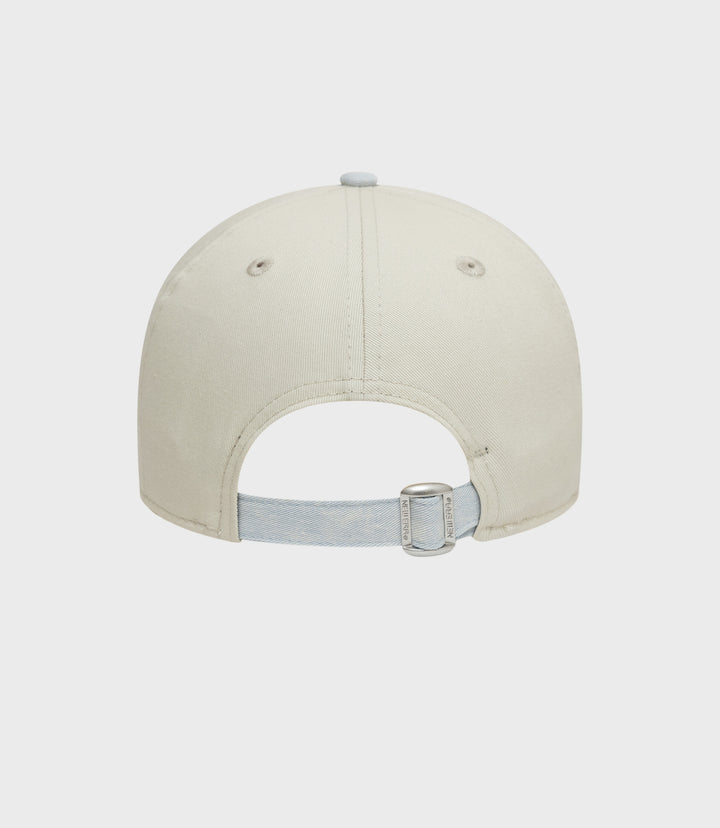 Cream New Era Alpine Acid Wash 9Forty cap front view showing crown and top button