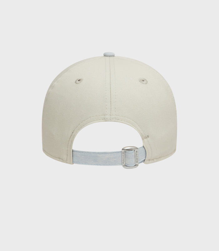 Cream New Era Alpine Acid Wash 9Forty cap front view showing crown and top button