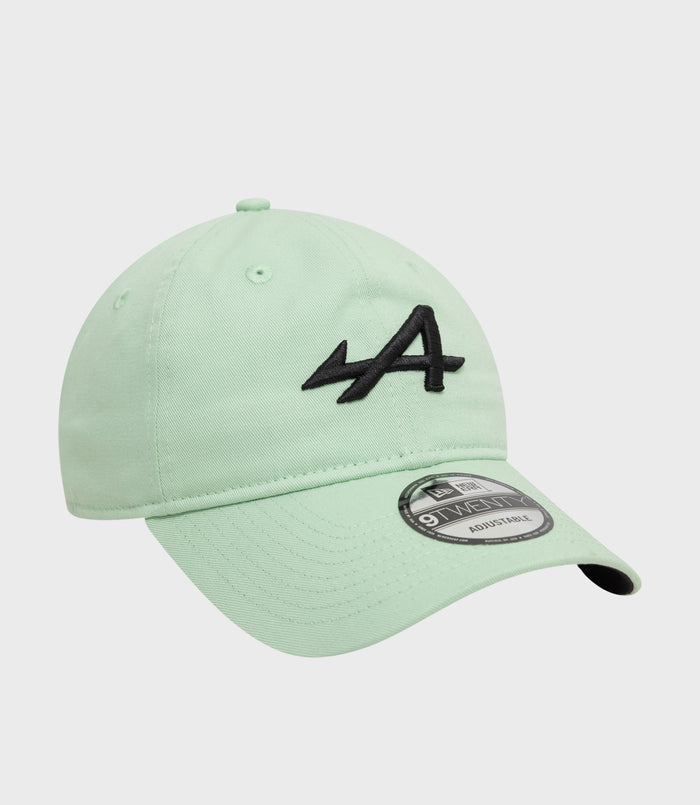 Mint green New Era Alpine 9Twenty cap close up from the side with brim sticker and black embroidery