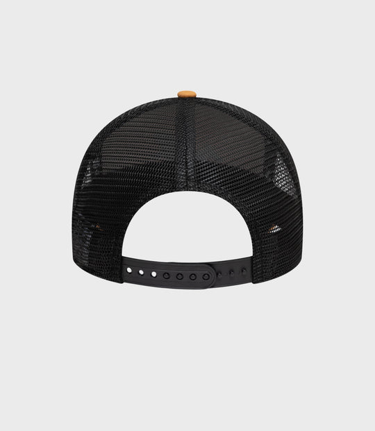 Top view of beige crown with black mesh back and small beige button on top