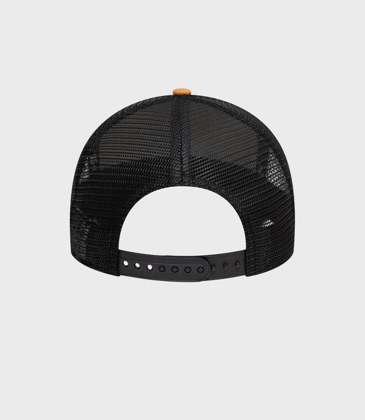 Top view of beige crown with black mesh back and small beige button on top