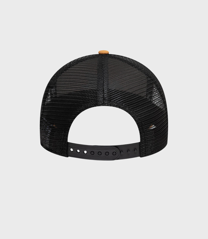 Top view of beige crown with black mesh back and small beige button on top