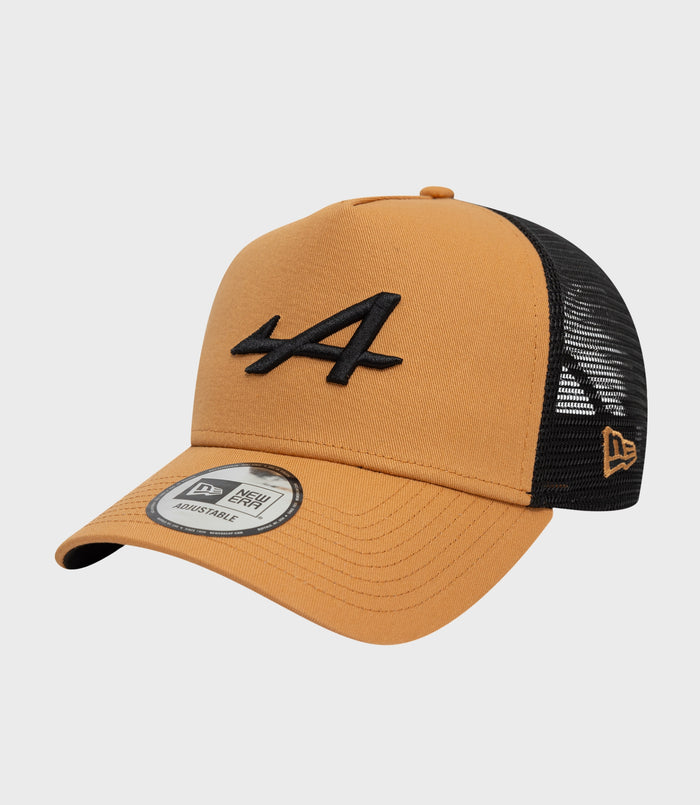 Beige New Era Alpine Seasonal E-Fame trucker cap with black mesh back and curved brim.