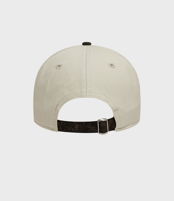 Rear view of white Alpine Acid Wash 9Twenty cap showing brown adjustable strap and denim brim