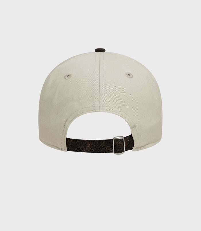 Rear view of white Alpine Acid Wash 9Twenty cap showing brown adjustable strap and denim brim