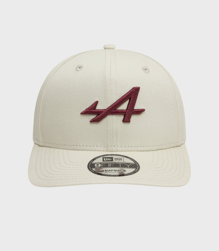 Front view of white New Era Alpine Seasonal 9Fifty cap with burgundy embroidered logo on the front panel