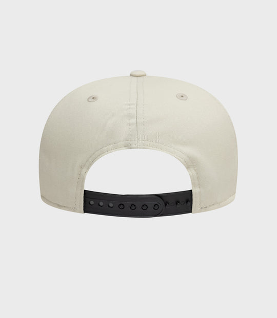 Back view of beige New Era Alpine Seasonal 9Fifty cap with black adjustable strap