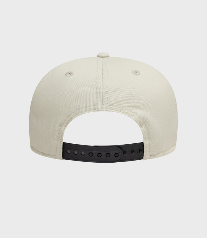 Back view of beige New Era Alpine Seasonal 9Fifty cap with black adjustable strap