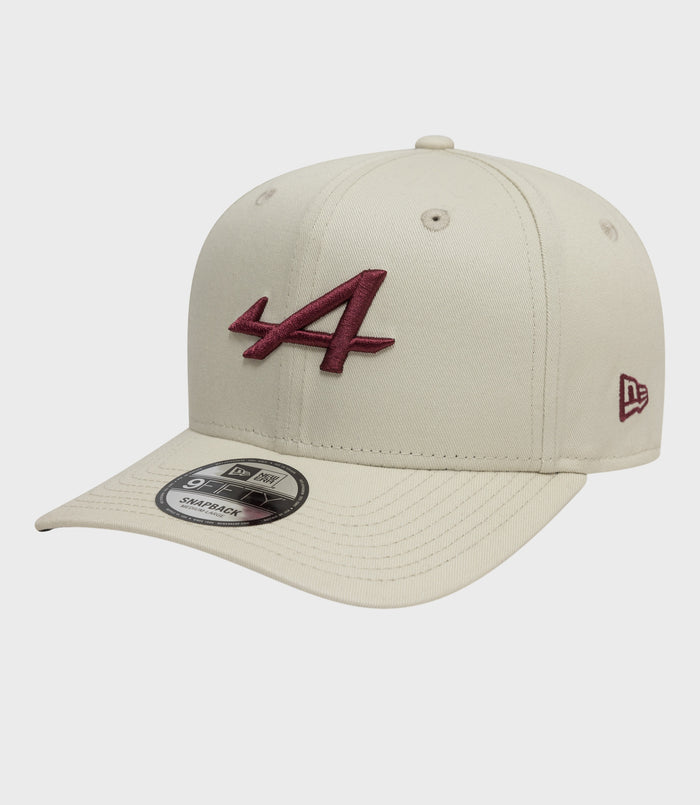 Cream New Era 9Fifty pre curved cap with burgundy embroidered logo on the front and brim sticker