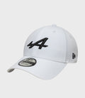White New Era 9Forty cap with teal brim and black embroidered logo on the front and a sticker on the visor