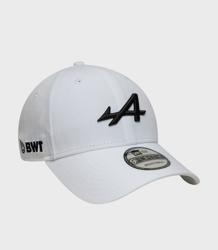 White 9Forty cap with black embroidered front logo and New Era sticker on the brim.