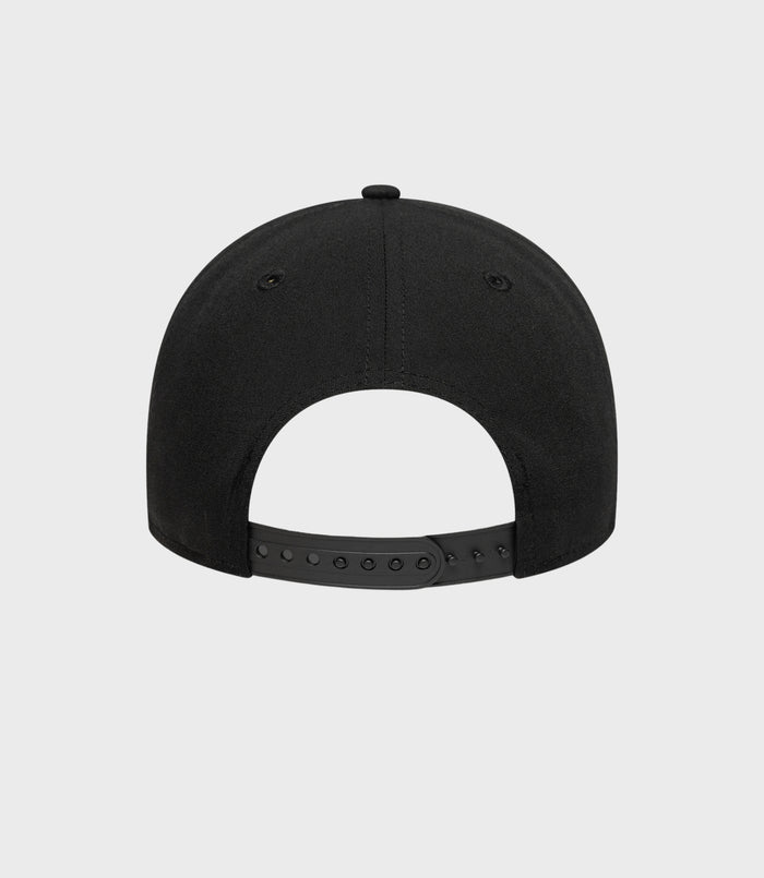 Rear view of the black New Era cap showing the adjustable snapback strap