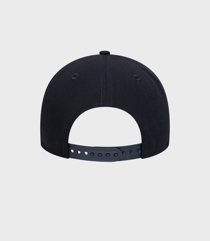 Rear view of navy New Era Alpine Repreve 9Forty cap with adjustable strap and top button