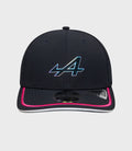 Front view of navy cap with iridescent logo on the crown and pink trim on the brim
