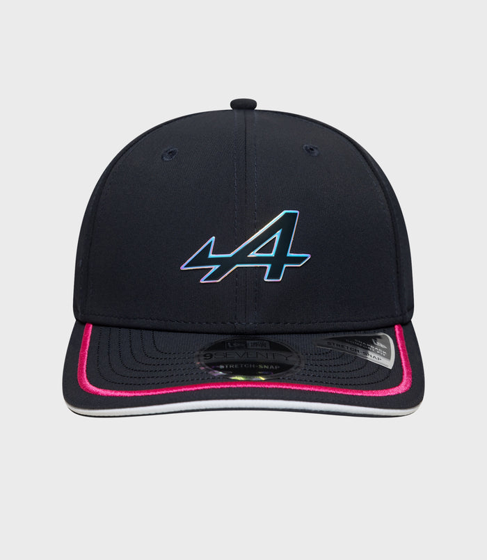 Front view of navy cap with iridescent logo on the crown and pink trim on the brim