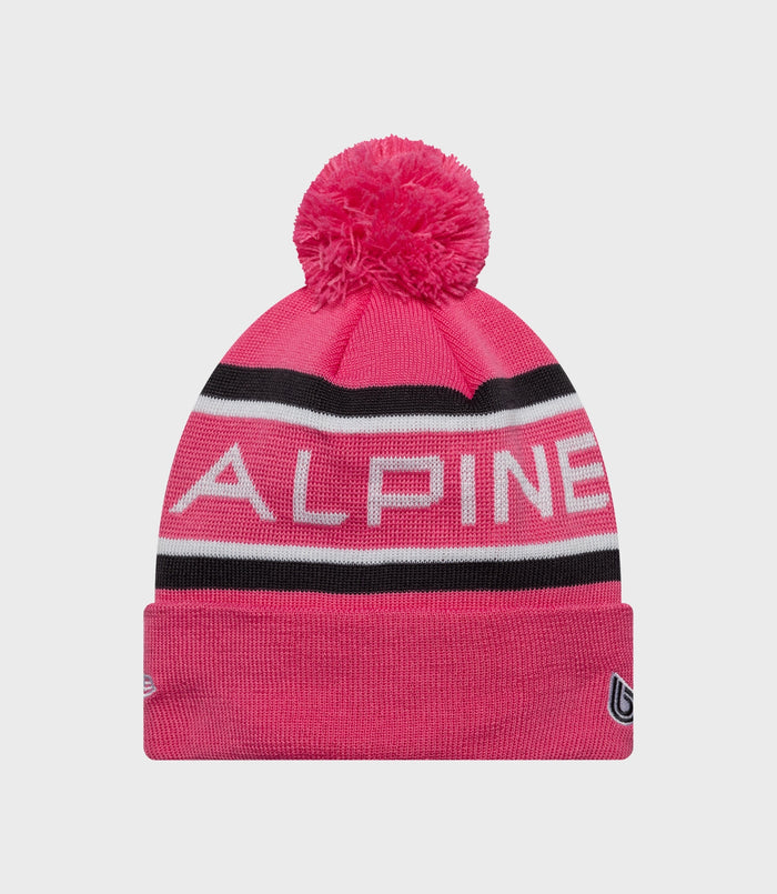 Pink Alpine cuff knit hat shown from the front with large white ALPINE lettering across the cuff
