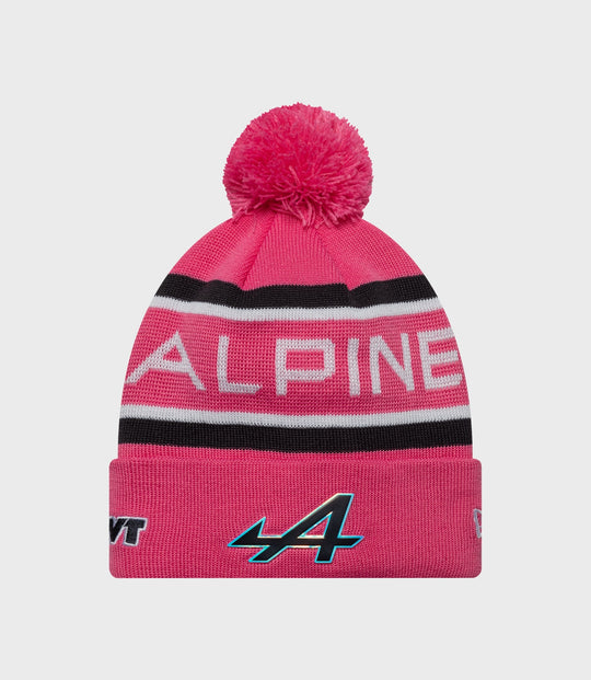 Pink cuff knit junior pop hat with a large fluffy pom and striped cuff in white black and pink