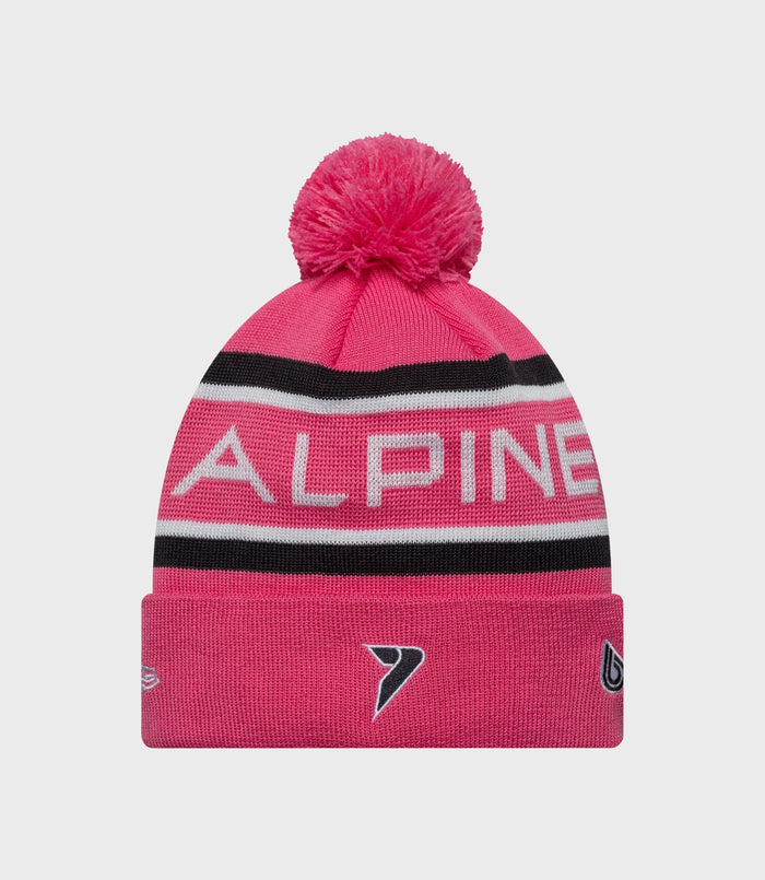 Pink New Era Alpine Team Kit cuff knit hat with a fluffy pom and striped cuff