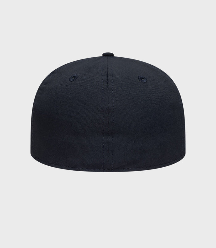 Front view of navy Alpine 59FIFTY cap with stitched crown and small top button.