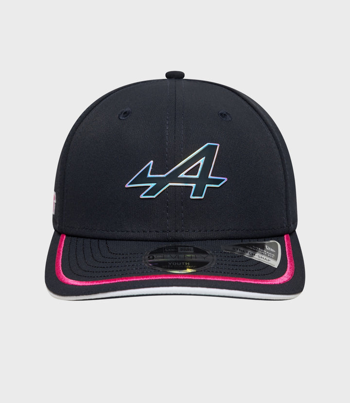Close-up of navy Alpine 9Seventy Junior cap with iridescent logo on the front crown