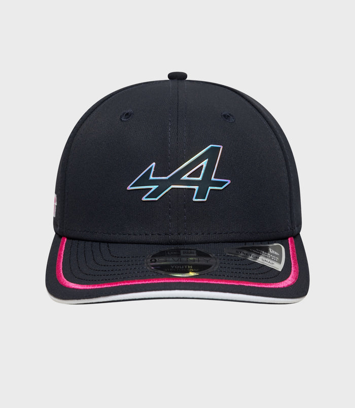 Close-up of navy Alpine 9Seventy Junior cap with iridescent logo on the front crown