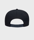 Back view of navy New Era Alpine 9Seventy cap with an adjustable plastic snap strap