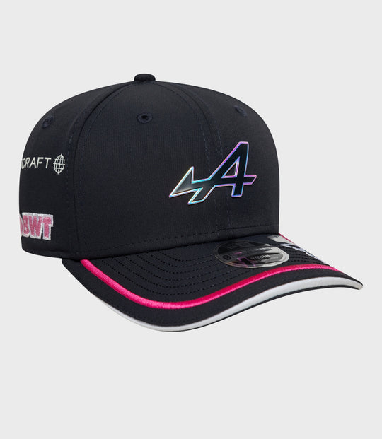 Front view of navy cap with large holographic logo and pink piping along the brim