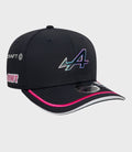 Front view of navy cap with large holographic logo and pink piping along the brim