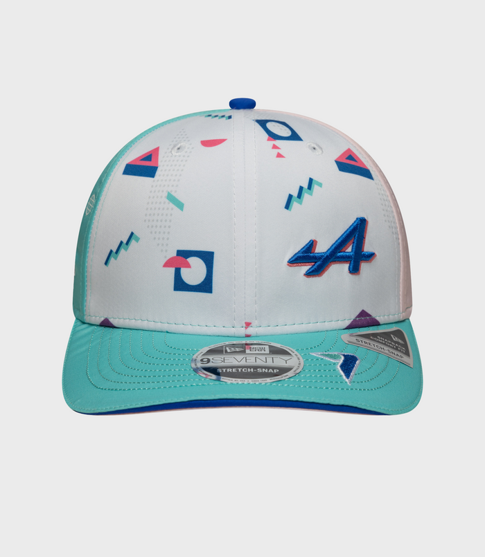 Rear view of the cap showing teal crown and pink adjustable strap with graphic prints and teal brim.