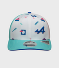 Close up of white patterned New Era Alpine Miami 9Seventy Stretch Snap Cap showing top button and teal brim.