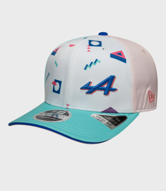 White 9Seventy Stretch Snap cap with a blue top button and pastel geometric graphics on the crown