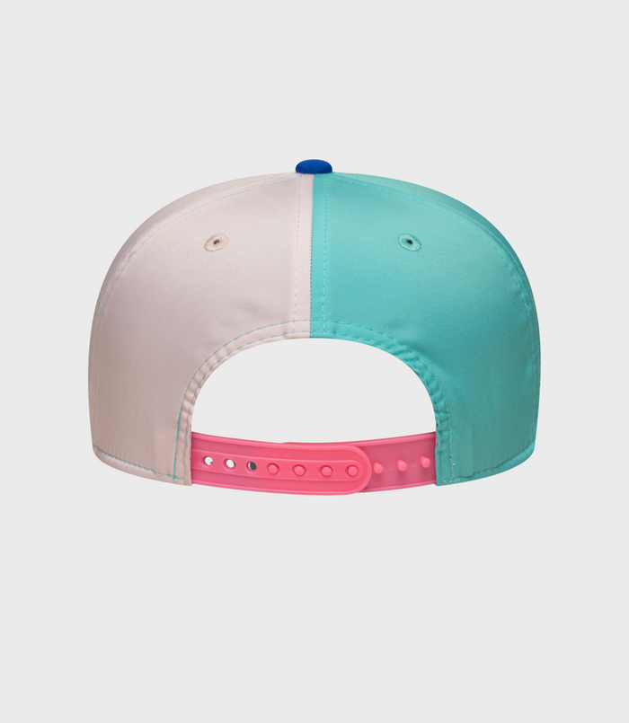 Back view of a pastel color block snap cap with a pink adjustable strap and turquoise brim