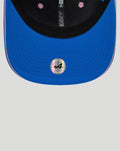 Blue New Era 9Seventy cap brim close up with pink edge and holographic 44 sticker