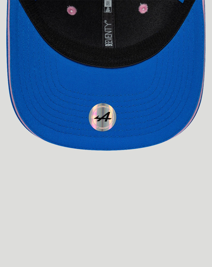 Blue New Era 9Seventy cap brim close up with pink edge and holographic 44 sticker