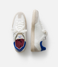 Top view of white Duke + Dexter sneakers with beige suede panels and light beige sole.