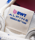 Beige fabric tag showing BWT Alpine logo and Alpine branding