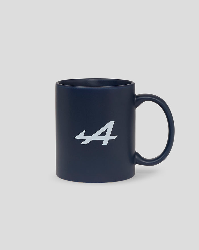 Side view of a navy ceramic mug featuring the Alpine 44 logo in white