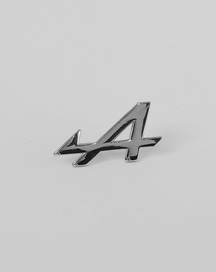 Shiny nickel BWT Alpine Formula One Team pin badge in the shape of the number 44