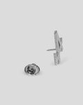 Back and side view of the nickel BWT Alpine pin badge with a pin clasp