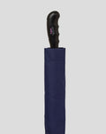 Close up of navy and pink BWT Alpine umbrella with curved black handle
